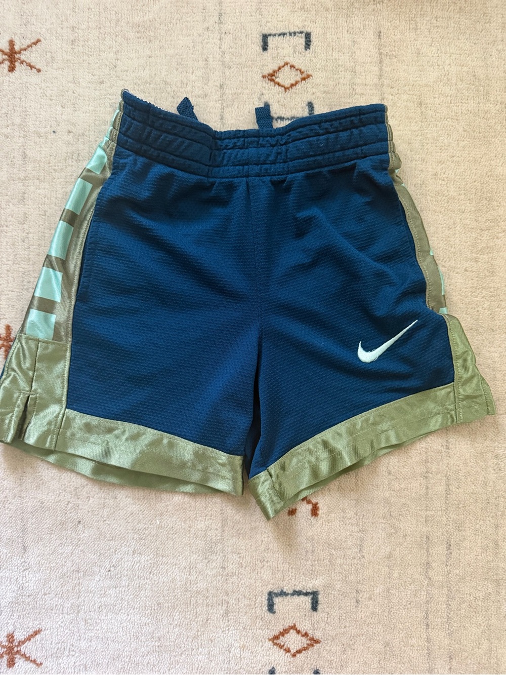 Boys Nike blue and green basketball shorts, size XS